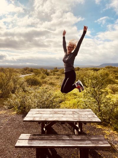 Thingvellir National Park - author jump up midair on a picnic table